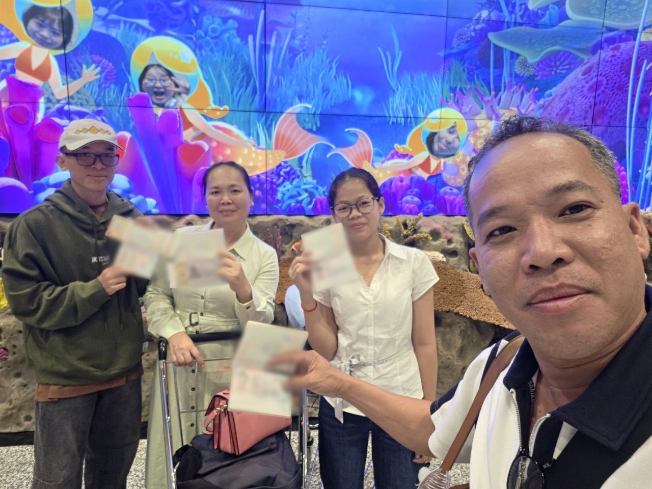 Cambodian students and their parents at the airport with their US visas